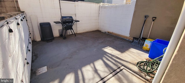 view of patio / terrace featuring a fenced backyard and a grill