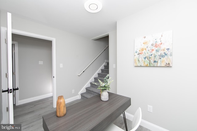 interior space with baseboards and dark wood finished floors