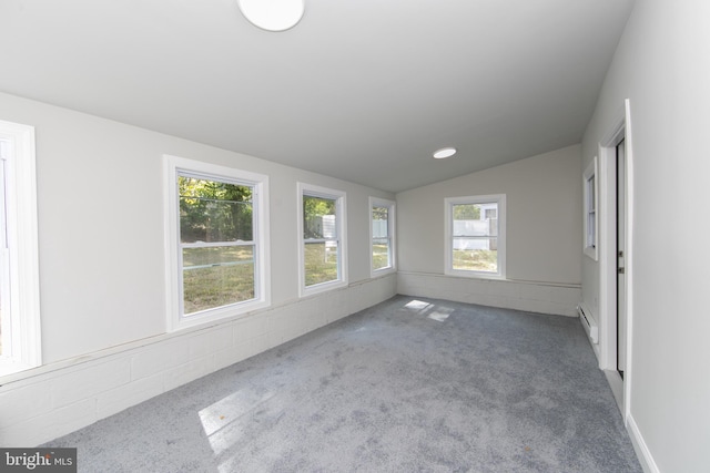 unfurnished sunroom with vaulted ceiling and a baseboard radiator