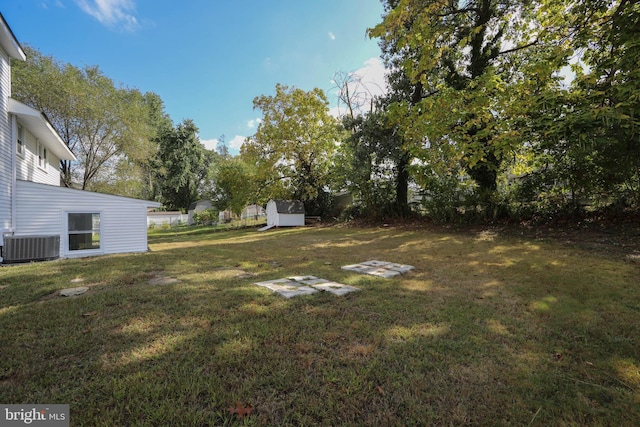 view of yard with central AC