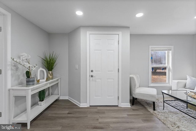 entrance foyer with recessed lighting, baseboards, and wood finished floors