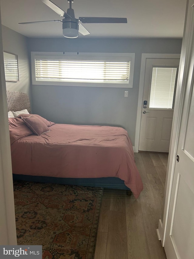 bedroom featuring a ceiling fan and wood finished floors