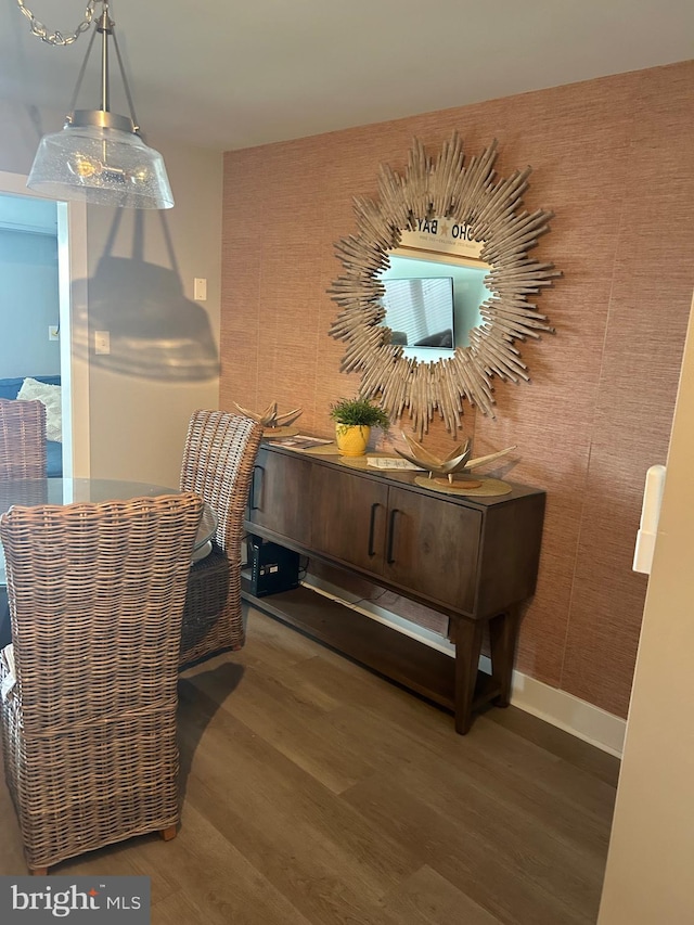 living area with dark wood-style floors and baseboards