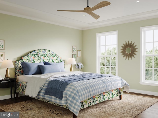 bedroom with crown molding, recessed lighting, ceiling fan, wood finished floors, and baseboards