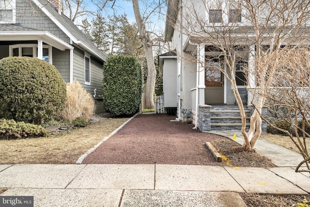 view of home's exterior featuring roof with shingles