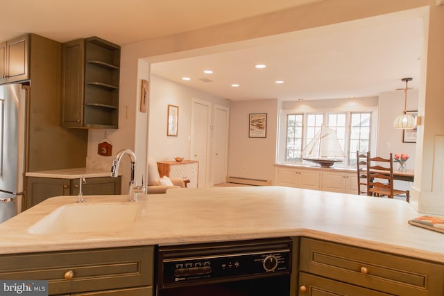 kitchen featuring black dishwasher, a baseboard radiator, freestanding refrigerator, a sink, and recessed lighting