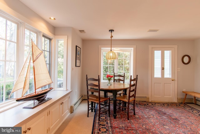 dining space with recessed lighting, a baseboard heating unit, light carpet, visible vents, and baseboards