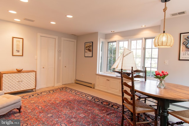 dining area featuring light colored carpet, visible vents, baseboard heating, and recessed lighting