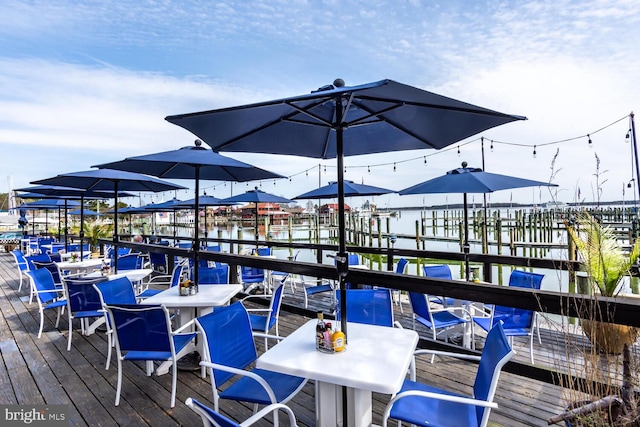 view of dock with outdoor dining space