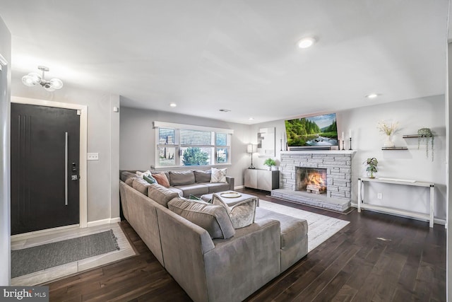 living area featuring baseboards, a fireplace, dark wood finished floors, and recessed lighting