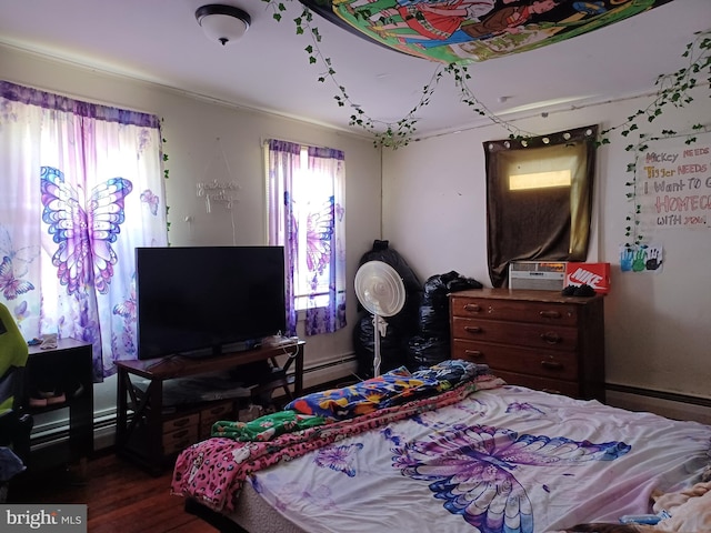 bedroom featuring dark wood-style floors, multiple windows, a baseboard heating unit, and cooling unit