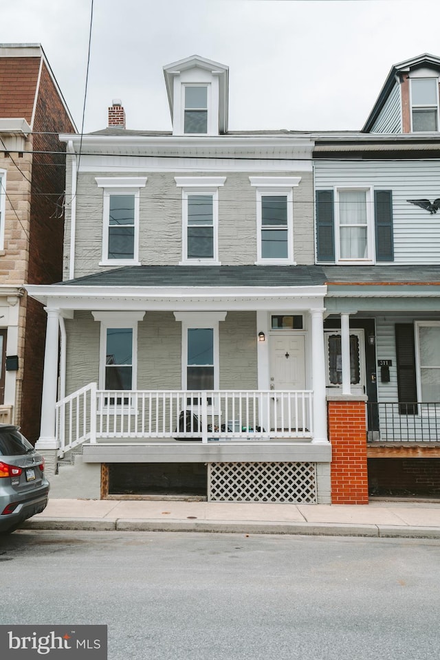 multi unit property featuring a porch