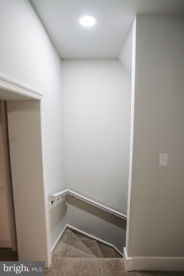 staircase with carpet and baseboards