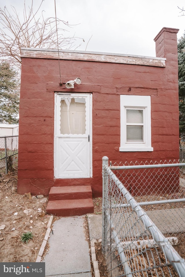 property entrance with fence