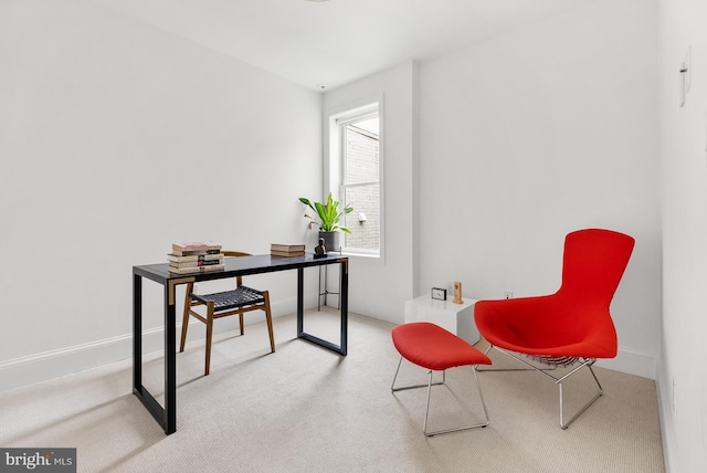 carpeted office featuring baseboards