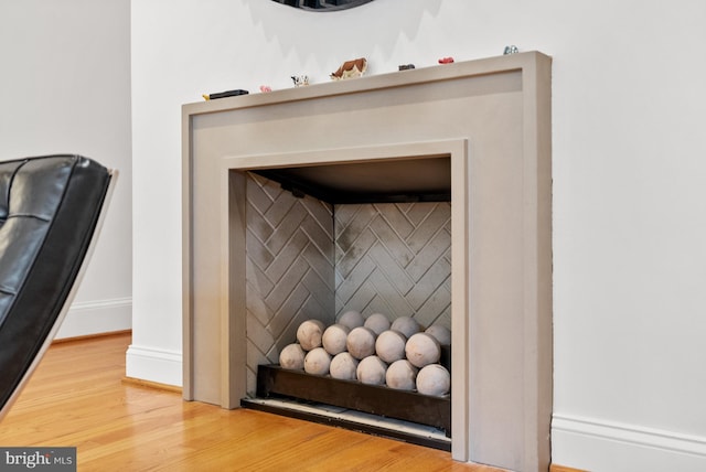 details with baseboards and wood finished floors