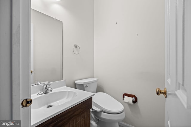 bathroom with toilet and vanity