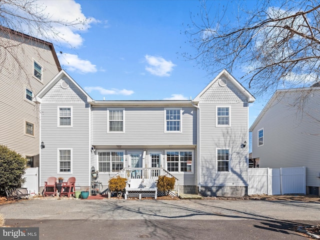 view of front of home featuring fence