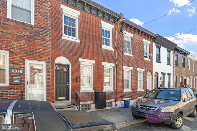 view of front of house with brick siding