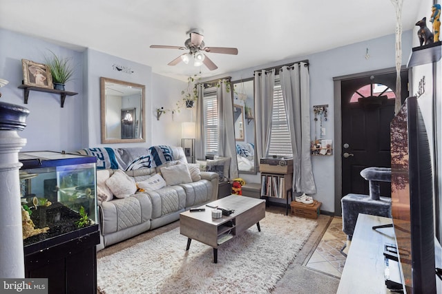 living area with ceiling fan