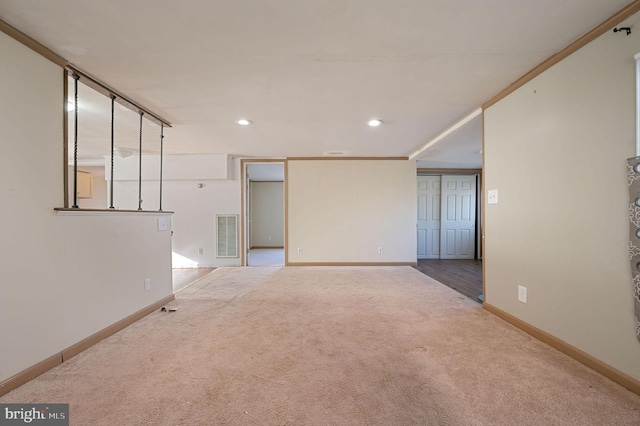 empty room with light carpet, baseboards, visible vents, and recessed lighting