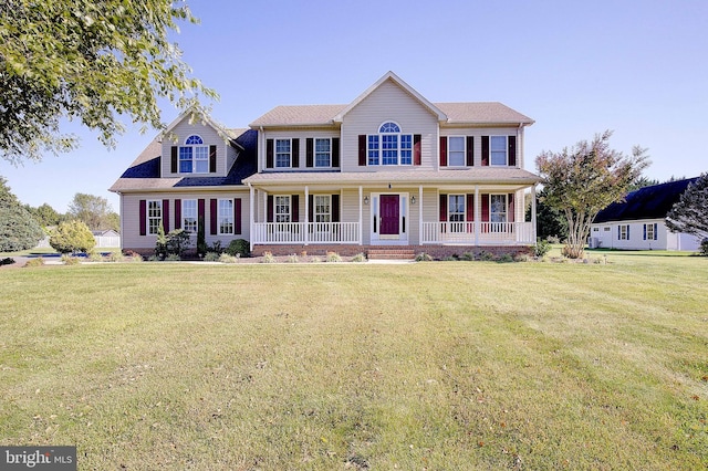 view of front of property featuring a porch and a front lawn