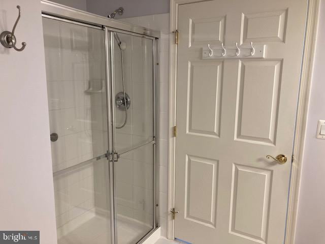 bathroom featuring a shower stall