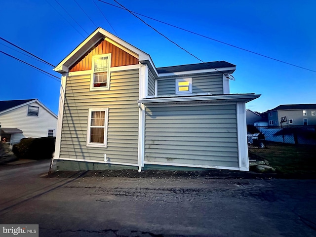 back of property with board and batten siding