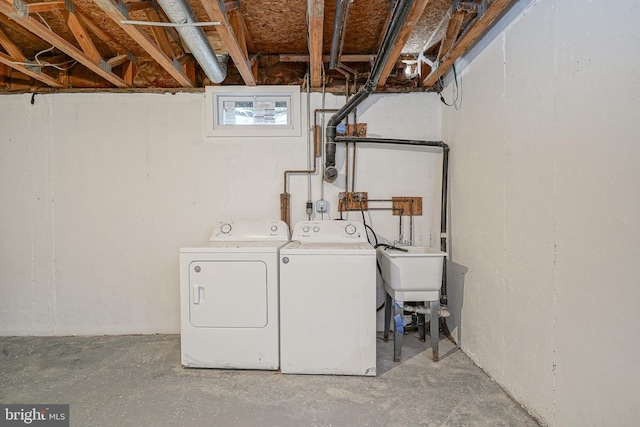 clothes washing area with laundry area and washing machine and clothes dryer