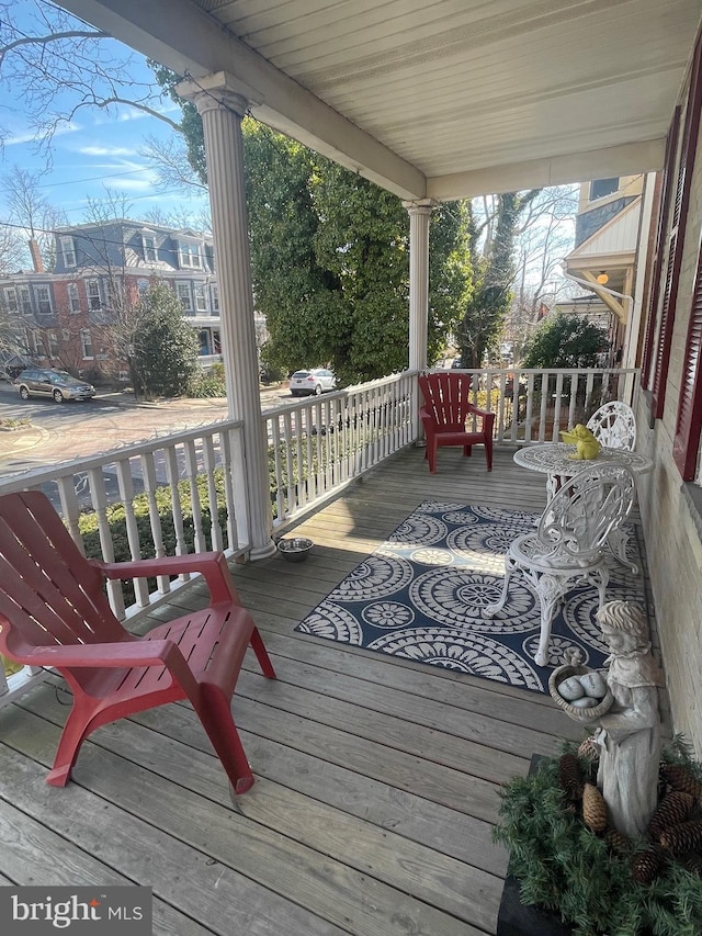 wooden terrace with a porch