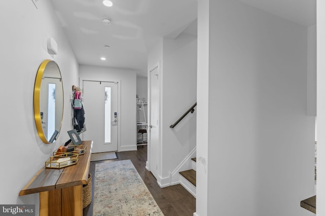 entryway featuring dark wood-style floors, recessed lighting, stairway, and baseboards