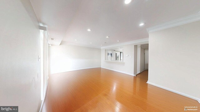 130 Saint Charles Sq Unit 130, Sterling, VA 20164 - spare room featuring crown molding, light wood-style flooring, recessed lighting, and baseboards