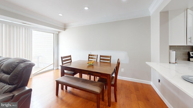 130 Saint Charles Sq Unit 130, Sterling, VA 20164 - dining area with ornamental molding, recessed lighting, visible vents, and light wood-style floors