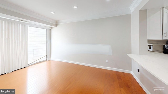 130 Saint Charles Sq Unit 130, Sterling, VA 20164 - interior space with light wood finished floors, recessed lighting, ornamental molding, and baseboards