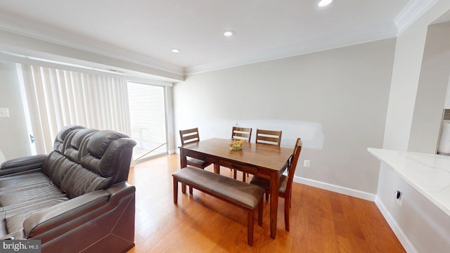 130 Saint Charles Sq Unit 130, Sterling, VA 20164 - dining room featuring light wood-type flooring, recessed lighting, ornamental molding, and baseboards