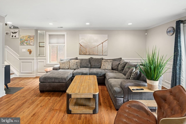 living area with stairs, recessed lighting, crown molding, and wood finished floors