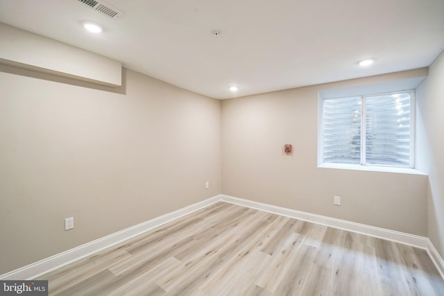 interior space with light wood finished floors, recessed lighting, visible vents, and baseboards