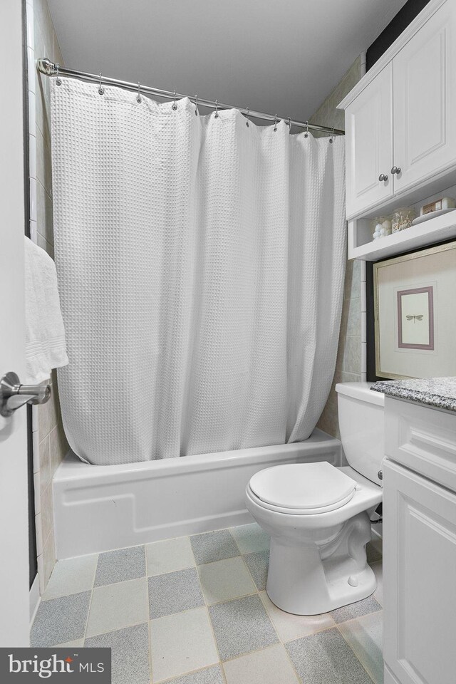 full bathroom with shower / bathtub combination with curtain, toilet, and vanity