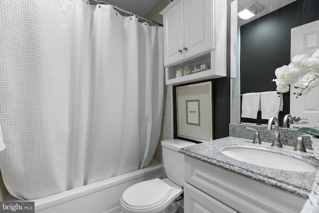 full bathroom with shower / bath combo, vanity, and toilet