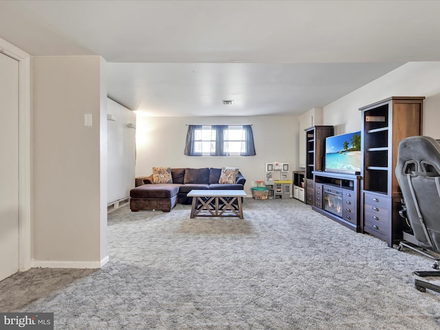 carpeted living room with baseboards and visible vents