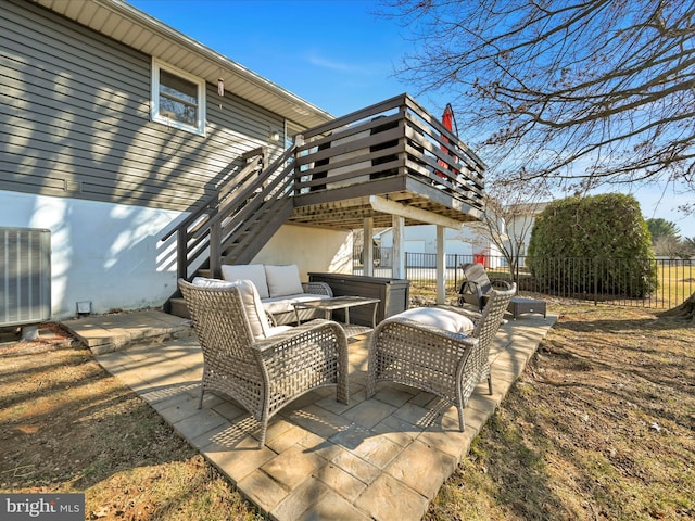 view of patio / terrace featuring stairs, central air condition unit, outdoor lounge area, and fence