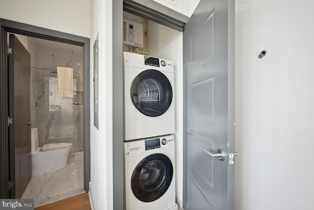 laundry room featuring laundry area and stacked washing maching and dryer