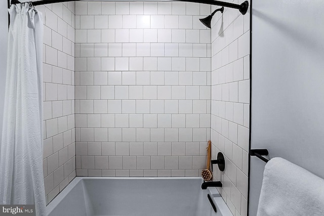 full bathroom with shower / bath combo with shower curtain