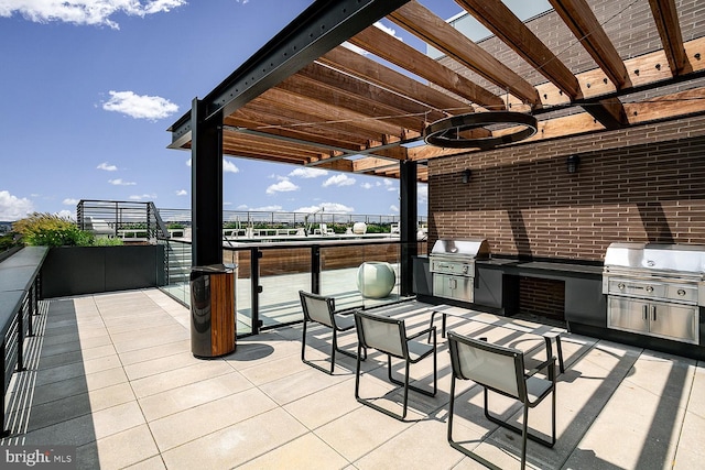 view of patio / terrace with grilling area and an outdoor kitchen