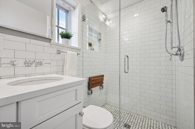 bathroom featuring a stall shower, decorative backsplash, toilet, vanity, and tile walls