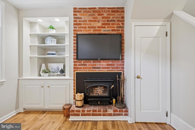 details with built in features, baseboards, and wood finished floors