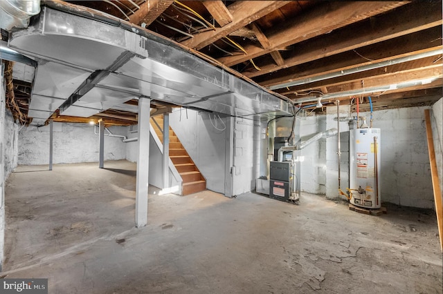 unfinished basement featuring heating unit, stairs, and water heater