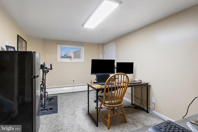 office area with a baseboard heating unit, baseboards, and light colored carpet