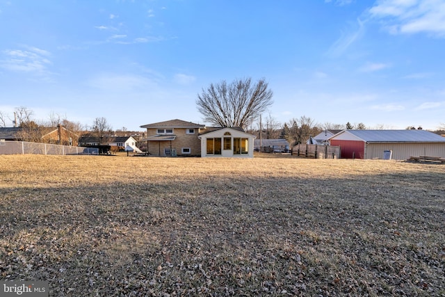 rear view of property with fence