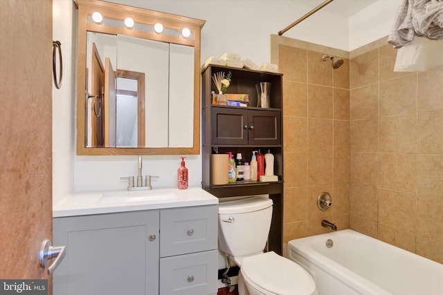 bathroom with shower / bathtub combination, vanity, and toilet